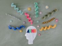 Creative illustration highlighting ADHD awareness with colorful brain imagery.