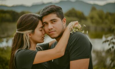 A young couple shares a tender embrace in San Cristóbal de las Casas, Mexico, with a scenic backdrop.